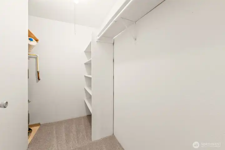 Extra large closet by the entrance with the 2-years old water heater has plenty of storage.