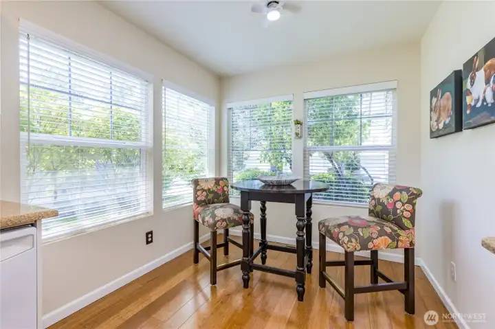 Breakfast nook offers a cozy place to enjoy your morning coffee and take in the beautiful landscaping.