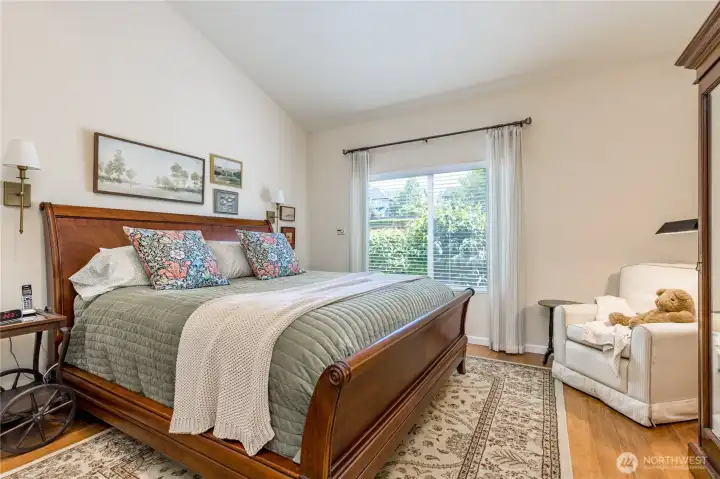 Enjoy the convenience of a main-level primary suite, featuring a walk-in closet and peaceful backyard views.