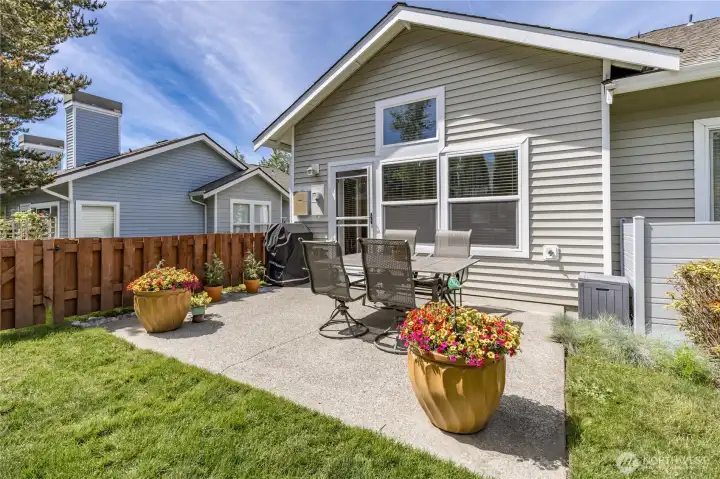 Private concrete patio located just off the living room, ideal for outdoor relaxation or entertaining.