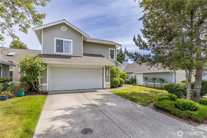 An attached 2-car garage and private driveway provide plenty of parking, plus nearby spaces for guests.