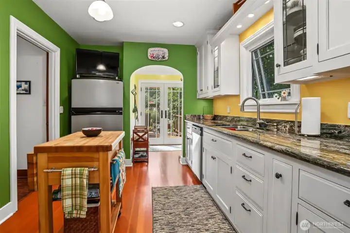 The remodeled kitchen features refinished original Fir flooring and beautiful Granite counter tops. The remodeled kitchen features refinished original Fir flooring and beautiful Granite counter tops.