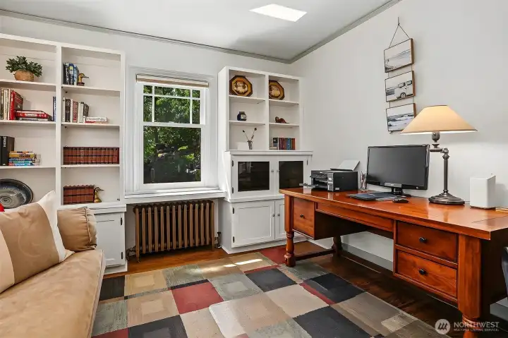 Main floor bedroom is currently used as a study. Sturdy bookcases and cabinetry have been added. Main floor bedroom is currently used as a study. Sturdy bookcases and cabinetry have been added.