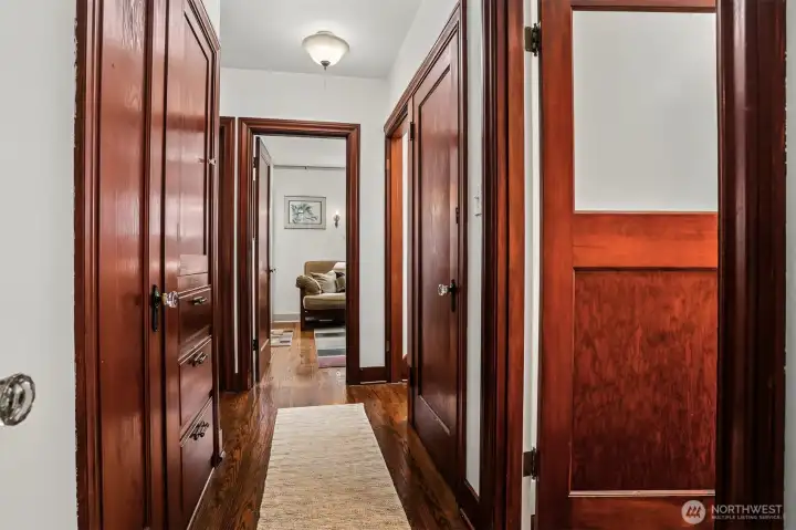 Main floor hallway has shining original woodwork in tact with handy built-in cupboard and drawers for added storage. Main floor hallway has shining original woodwork in tact with handy built-in cupboard and drawers for added storage.