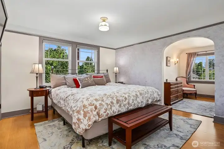 Here is the primary bedroom which also has hardwood flooring and a spacious alcove. Here is the primary bedroom which also has hardwood flooring and a spacious alcove.