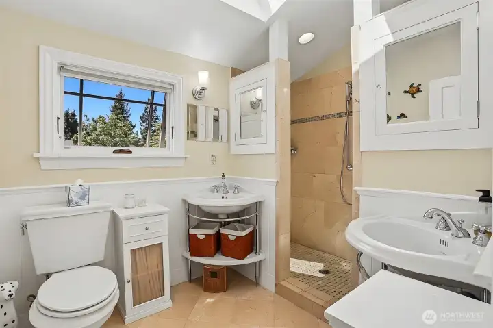 The upper bathroom has also been remodeled. It features dual vanities, craftsman styling and gorgeous Crema Marfil Marble tile flooring and shower. The upper bathroom has also been remodeled. It features dual vanities, craftsman styling and gorgeous Crema Marfil Marble tile flooring and shower.