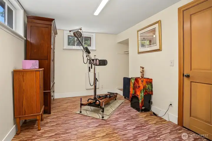 Lower non-conforming 4th bedroom has two windows and a closet area. Currently used as an exercise room. Lower non-conforming 4th bedroom has two windows and a closet area. Currently used as an exercise room.
