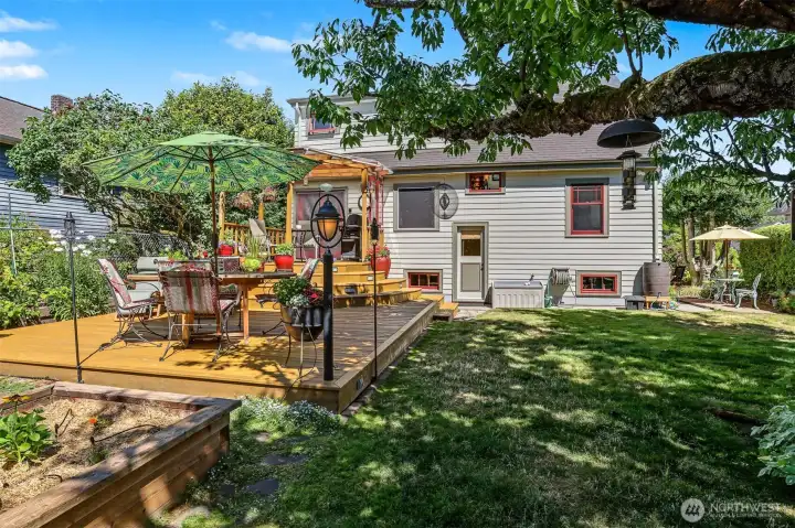 The backyard has a fantastic two level deck, raised garden beds, beautiful established plants, trees and flowers. The entire property is really is a Gardener's paradise! The backyard has a fantastic two level deck, raised garden beds, beautiful established plants, trees and flowers. The entire property is really is a Gardener's paradise!