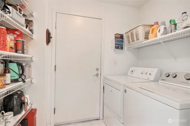 Pantry and walk-in laundry with side-by-side laundry.