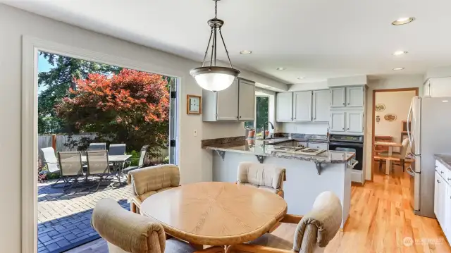 Enjoy an informal dining space just off the kitchen with french doors to the entertainment sized patio out back to easily host inside and out all summer long!