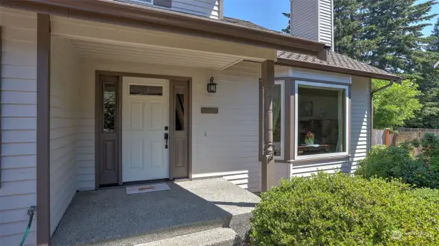 This giant covered front entry greets your guests rain or shine.