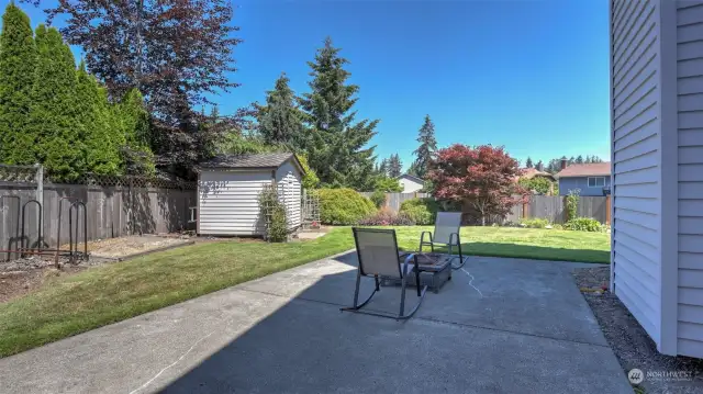 Second patio is on the side of the home and offers great spot for firepit or garden beds with the shed nearby.