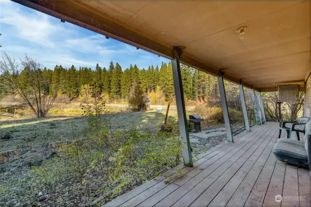 Covered back deck facing pond