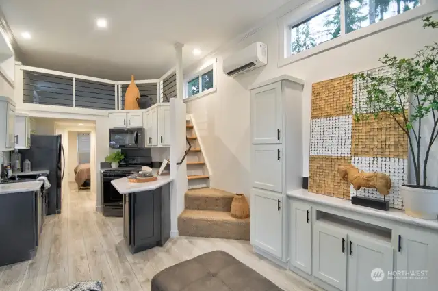 KITCHEN WITH BLACK FARM SINK AND GAS STOVE/STAIRS TO THE LOFT