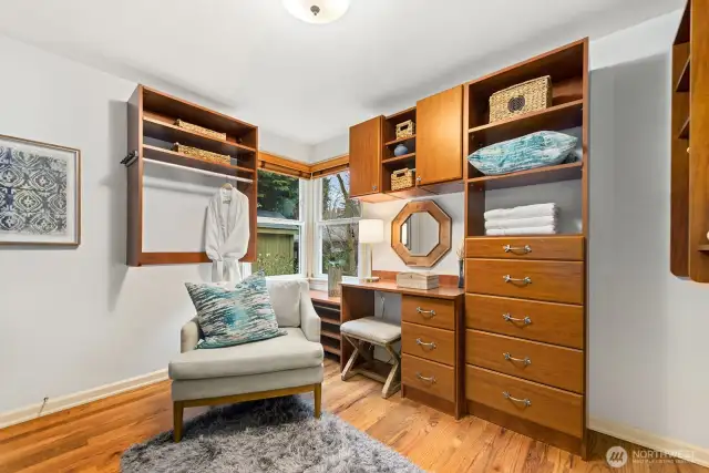 Garden views from the corner windows. Built in shelving and desk provide potential for a multi purpose space.