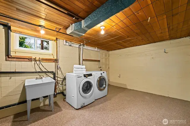 Huge laundry room is an ideal location for an additional bath.