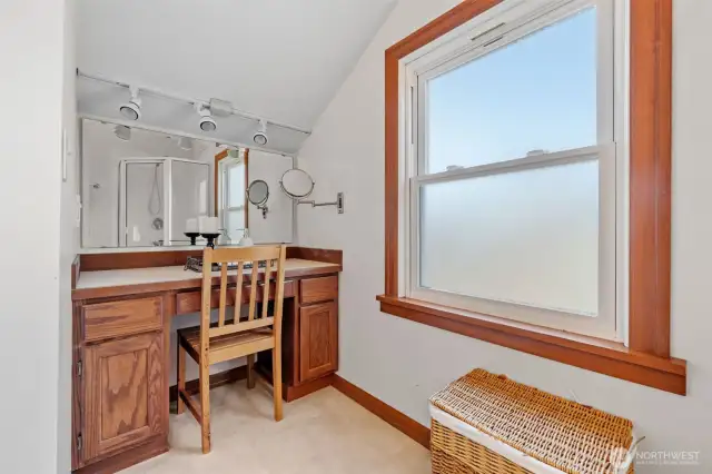 A dedicated vanity area with built-in lighting and mirror adds an extra touch of convenience and luxury to your daily routine.
