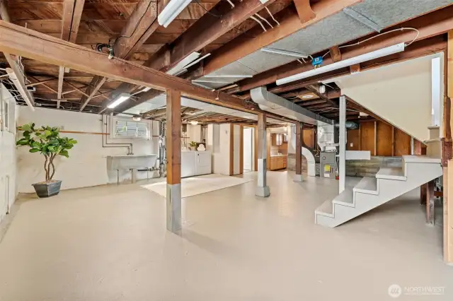 Expansive and freshly painted, this versatile basement is brimming with potential—ideal for a home gym, creative workspace, or future customization. Featuring laundry hook-ups, a ¾ bathroom, built-in storage, and a convenient side entrance at the top of the stairs, this space offers endless possibilities—including the potential for an ADU!