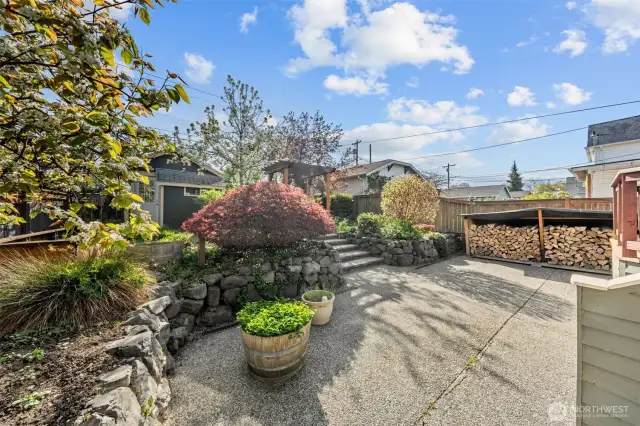 Enjoy the sunny patio surrounded by mature landscaping and a custom-built wood storage area, wood included with purchase —perfect for backyard entertaining or quiet mornings outside.