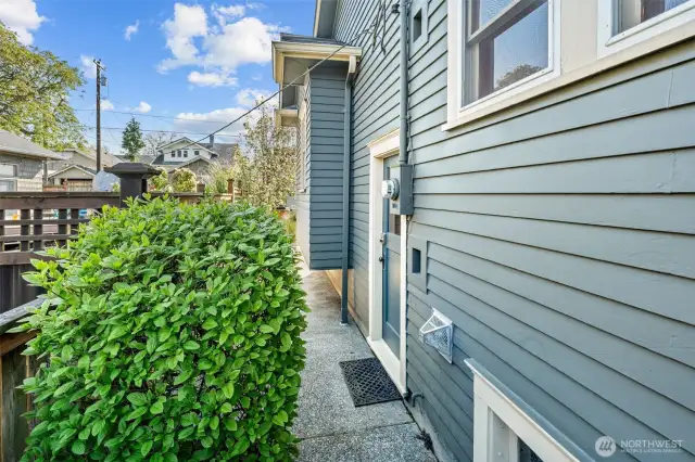 A closer look at the side entrance—perfect for separate access to the basement, or ADU access, or as a practical mudroom entry after gardening or enjoying the outdoors.