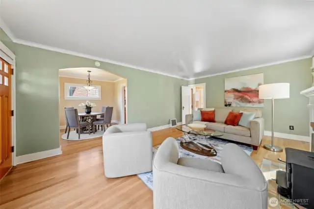As you enter through the front door, you're welcomed by a bright and inviting living room with an easy, flowing floor plan that connects seamlessly to the dining area.