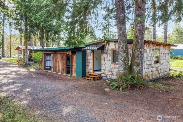 Outbuilding with finished studio on one side.