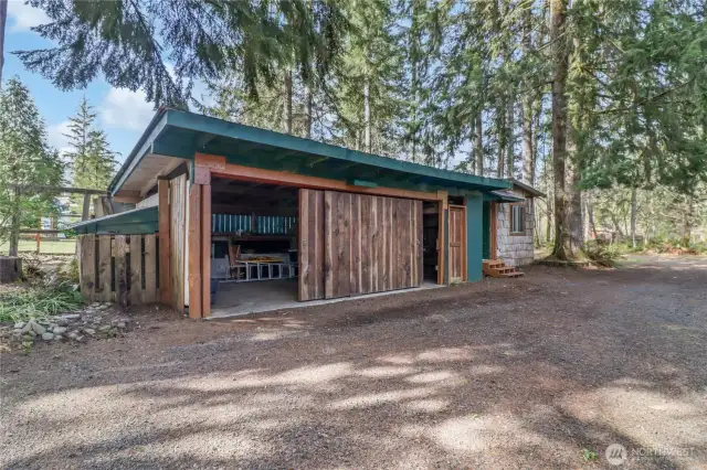 Outbuilding with finished studio on one side.