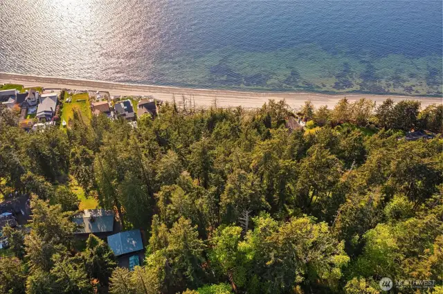 Aerial of home, garage, and beach access.