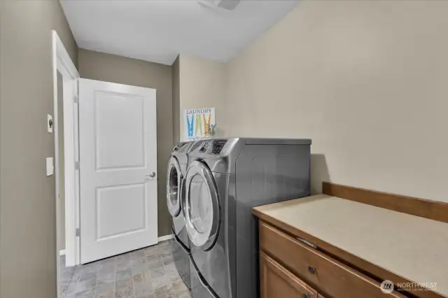 Walk through laundry from primary walk in closet to hallway.