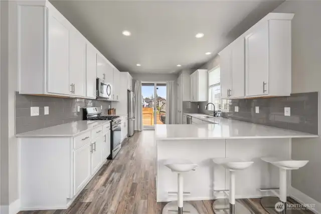 View of kitchen w/ eating space.