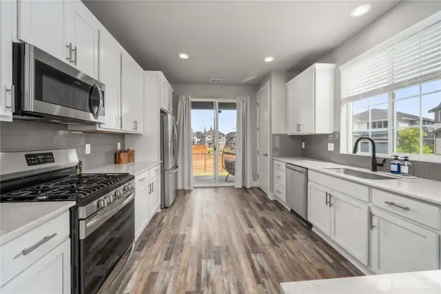 Modern kitchen w/ stainless appliances.