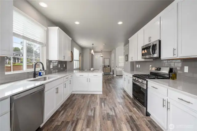Modern kitchen w/ stainless appliances.