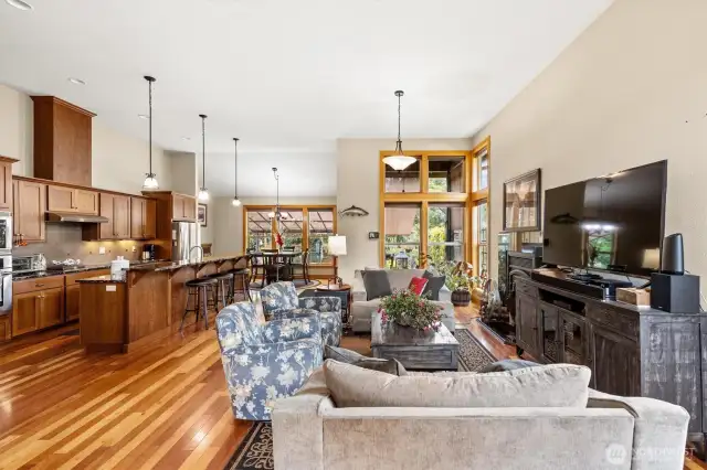 Open concept living room with wood burning fireplace