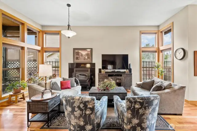 Natural lighting in living area with vaulted ceilings that enter into the kitchen area