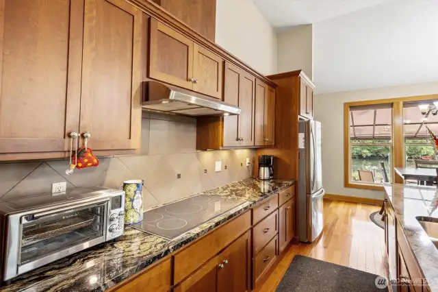 Flat top kitchen stove and stainless-steel refrigerator for all your cooking needs