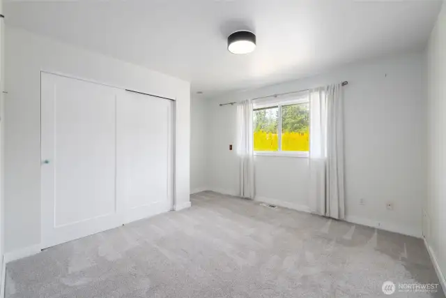 Upstairs back bedroom.