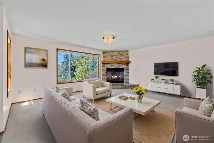 Livingroom with large windows facing the view.