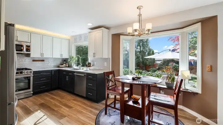 Start your mornings in this charming breakfast nook overlooking the lush greenery in the backyard.