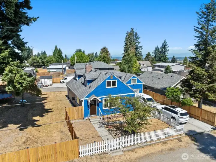 Fence to left of front door shows approx new property line that will extend towards backyard towards back lot #C.  Where the large trees are located, that is lot B and not for sale.