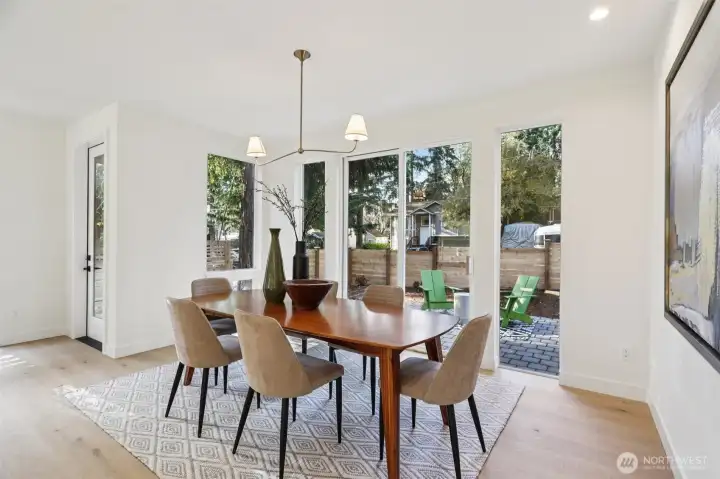 Formal dining room with sliders to front yard patio