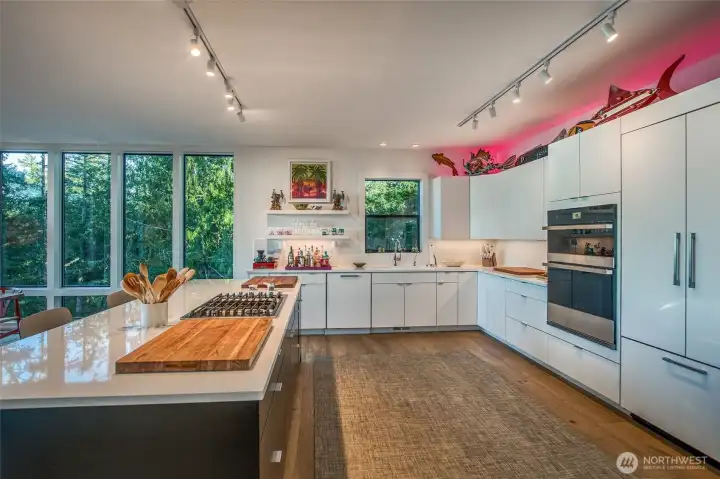 Custom kitchen with quartz counters and over counter lighting adaptable controls from your phone!