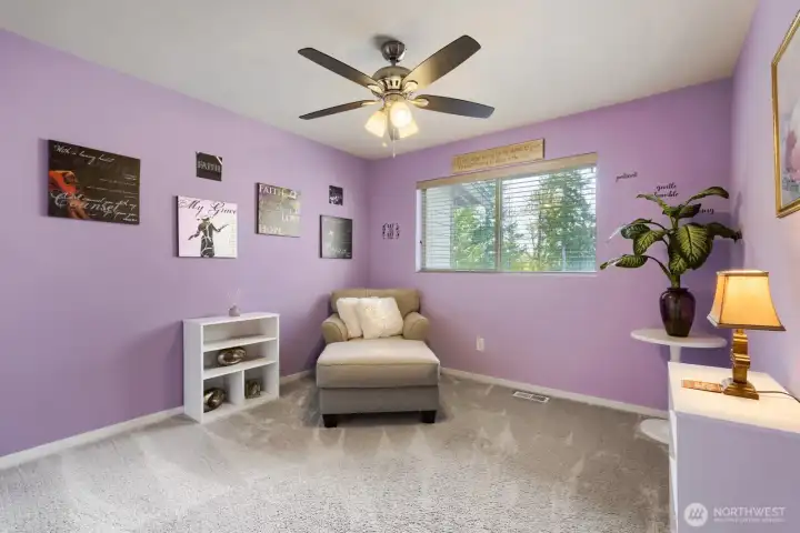 Upper-level bedroom #2 featuring a ceiling fan, plush carpeting, and additional space for comfort and versatility.