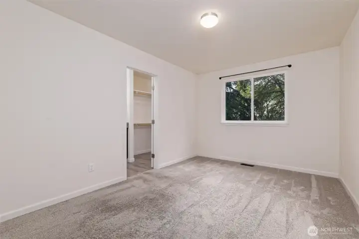 Primary bedroom and walk-in closet.