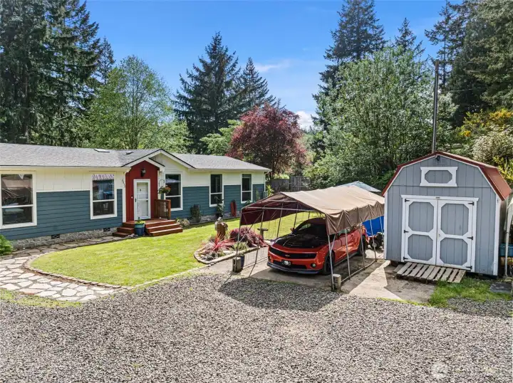 Shed conveys with home and can be moved to another location - property line is approximately lined up with the telephone pole