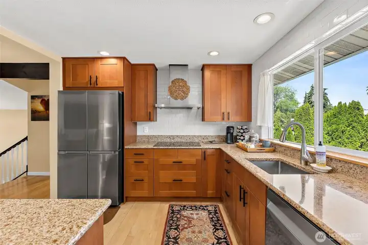 Enjoy breathtaking, unobstructed views of the pool through the large kitchen window, bringing natural light and a resort-like feel into the heart of the home.