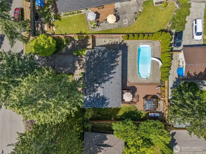 Extremely well manicured yard with NEW ROOF in 2022. Additional parking on left side of garage for RV or boat parking.