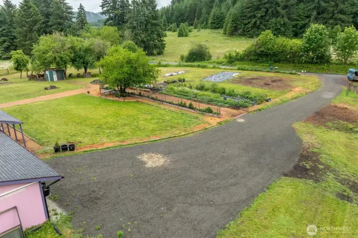 Front yard with large established garden. Front yard with large established garden.
