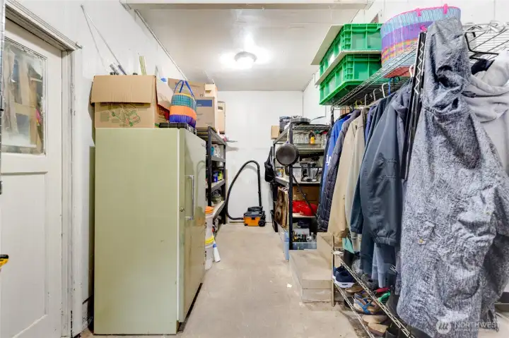 Storage area between house and garage. Storage area between house and garage.