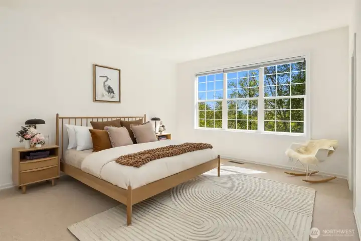 Spacious Primary Suite overlooking the backyard
