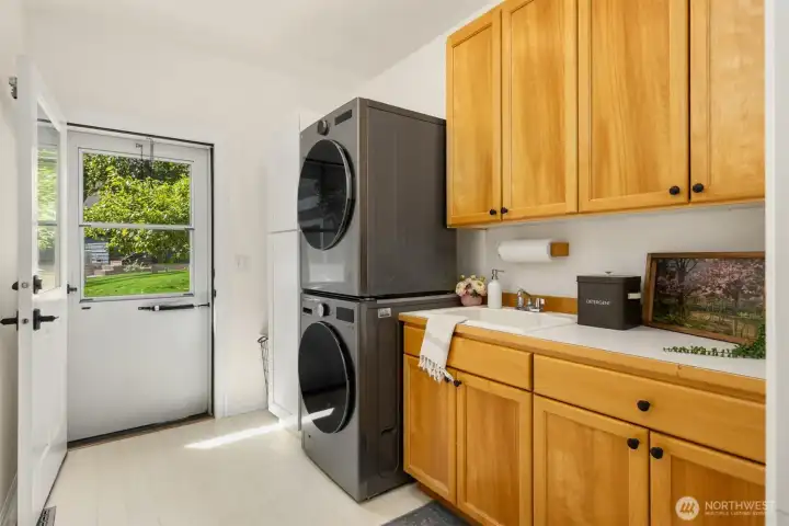Laundry room with side entrance from driveway.